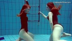 Play Two good girls taking a shower together and touching each other's breasts and pussy